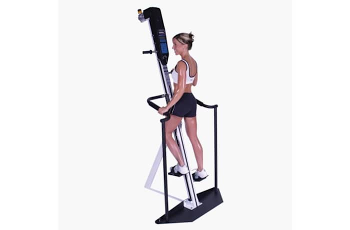 A woman using the Versaclimber machine